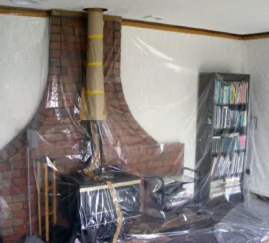 The interior of a house wrapped in plastic to prepare for painting and plastering. 